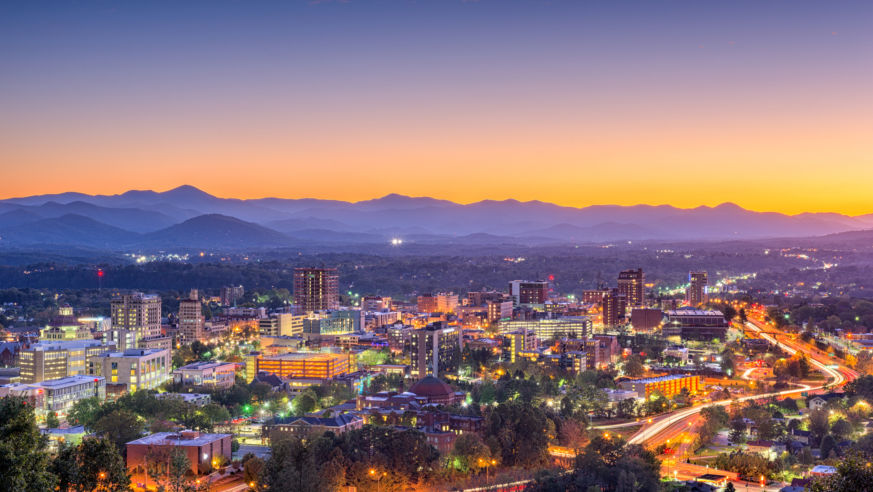 asheville skyline at dusk, mountains in background