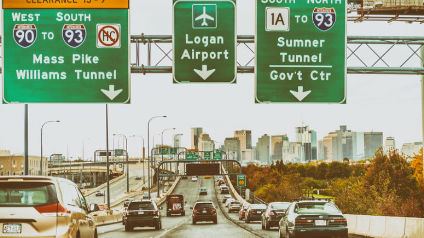 Traffic in Boston with green traffic signs