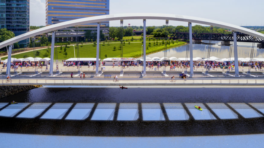 Bridge with festival tents over river