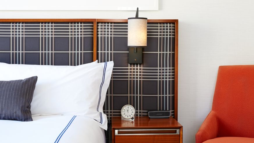 Bed and side table Godfrey Hotel