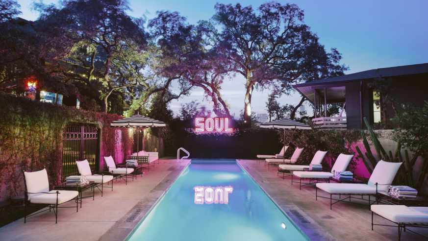 pool at dusk with SOUL neon light sign