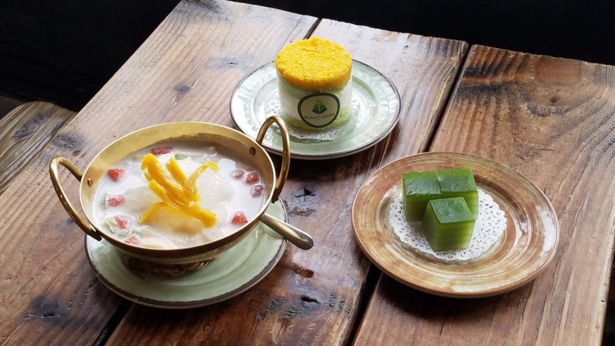 three pastries on a wood table
