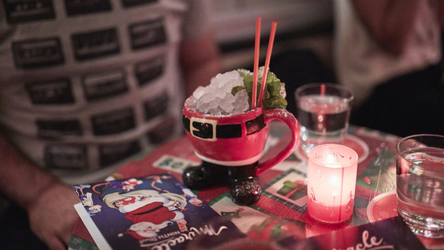 Santa mug at table with candle