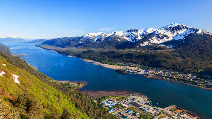 aerial view mountains and town on coast
