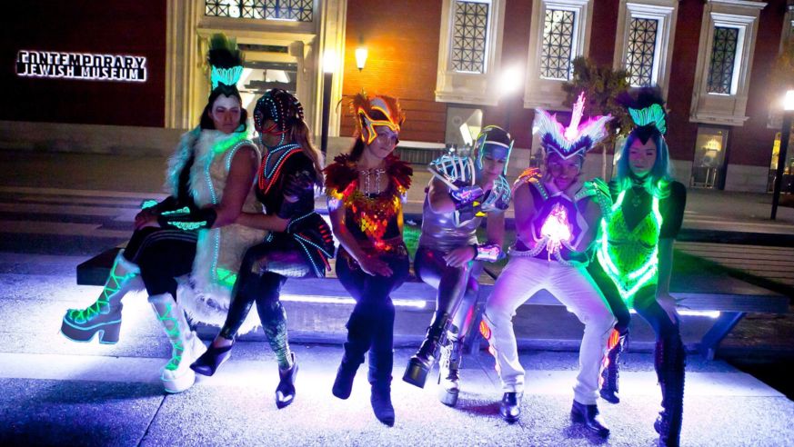 Row of people wearing neon
