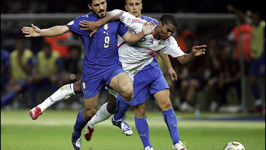 France's Florent Malouda (in white) is brought down by an Italian rival in the 2006 World Cup final, which Italy won