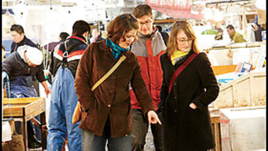 Guide Yukari Sakamoto (left) with Mike and Laura at Tokyo's Tsukiji Market