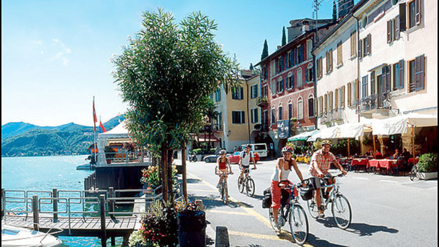 Cycling past Lake Lugano in Switzerland