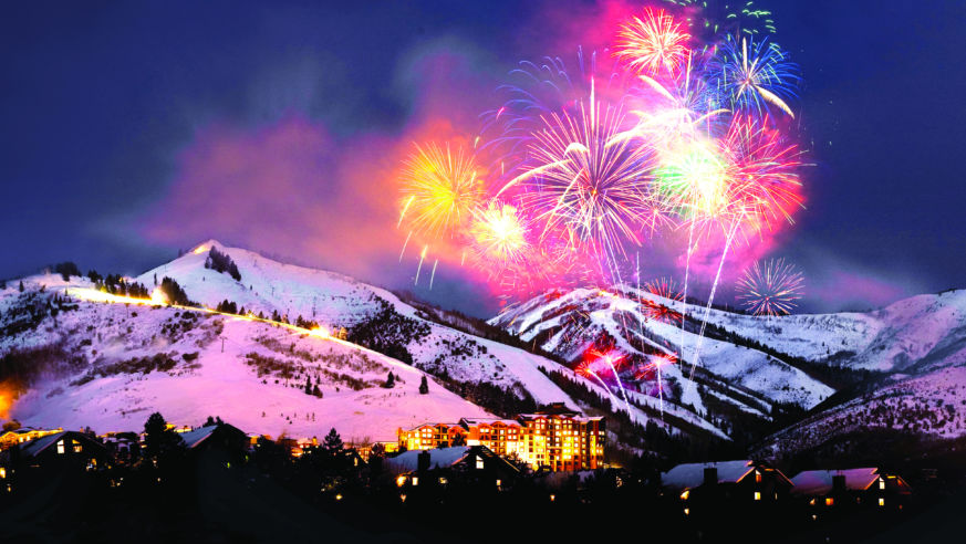 fireworks over town in mountains