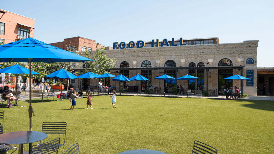 Green lawn with food court in background