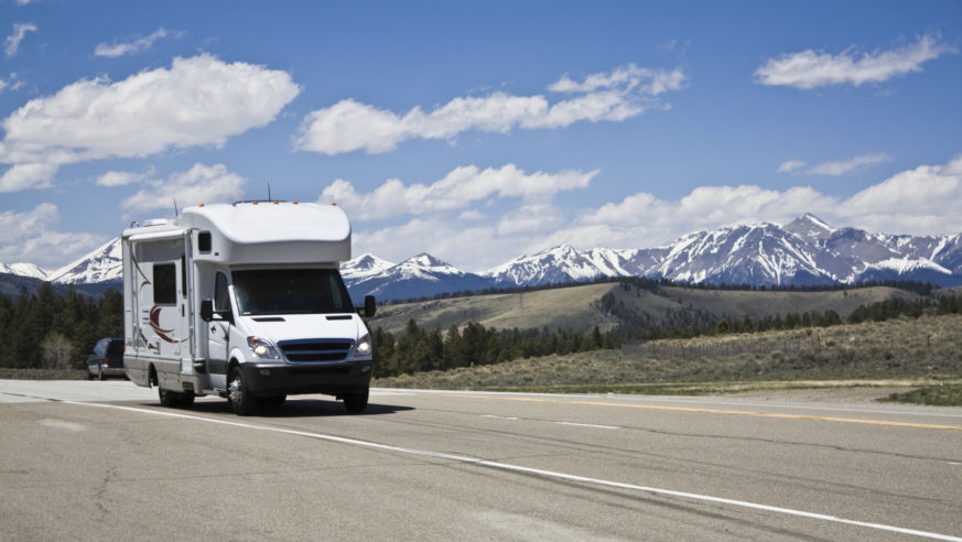 View of a highway in the Colorado Rockies with an RV.