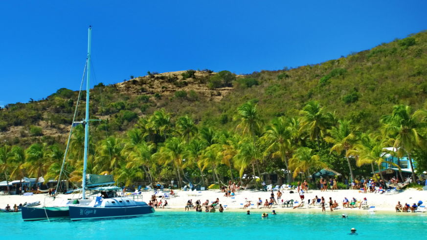 tropical beach with sailboat