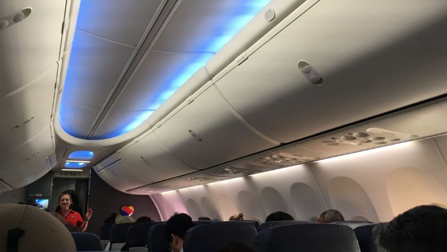 A Southwest Airlines flight attendant leads a safety demonstration