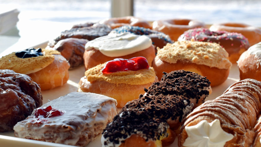 Tray of colorful donuts