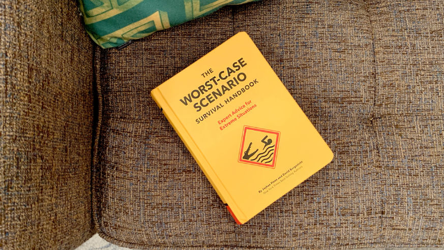 Yellow book on brown couch