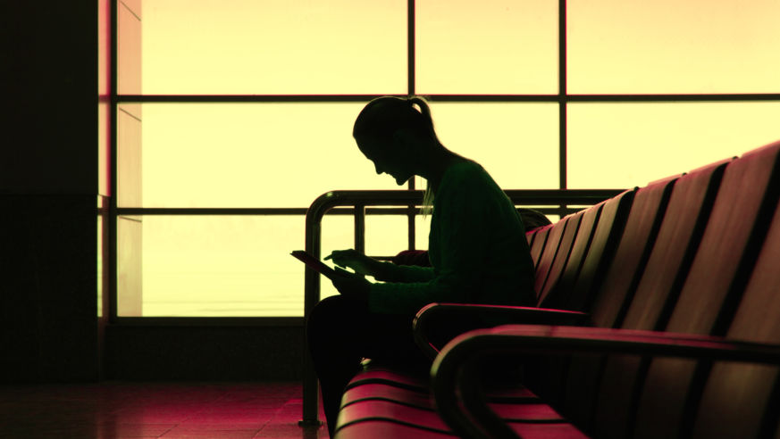 Woman with tablet at airport