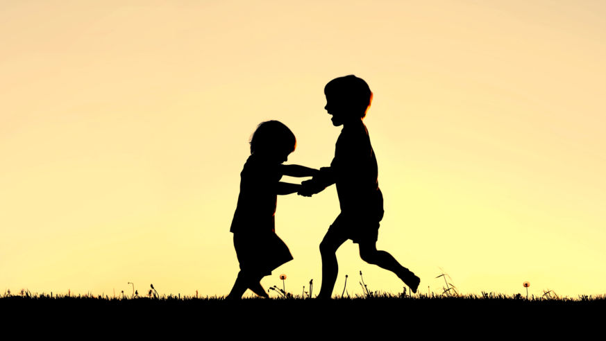 Kids frolicking at sunset