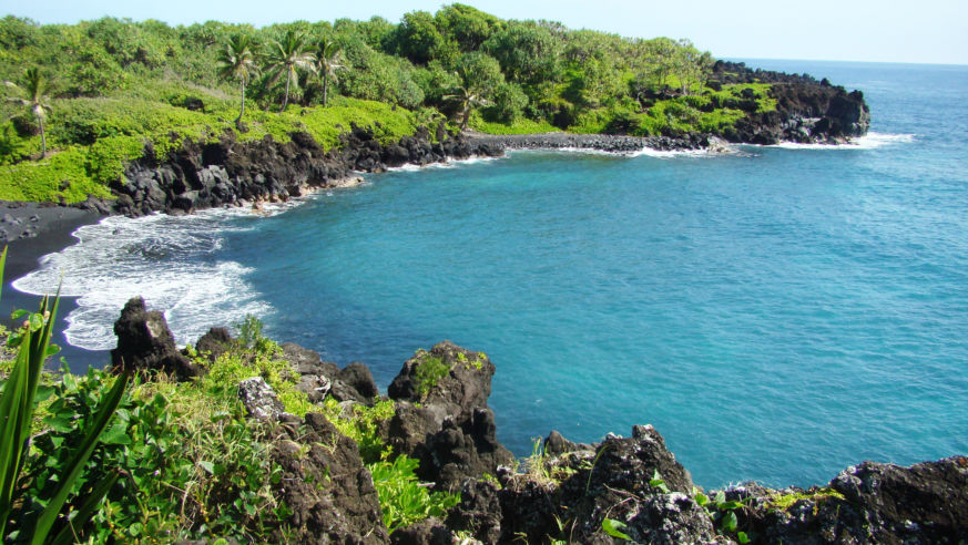 Maui black sand beach along the road to Hana