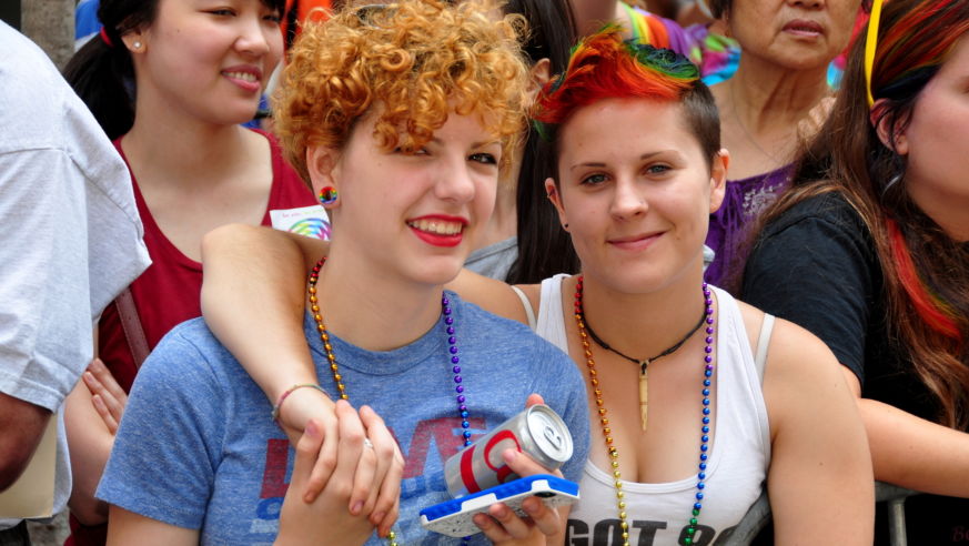 NYC Pride Parade, two women watch