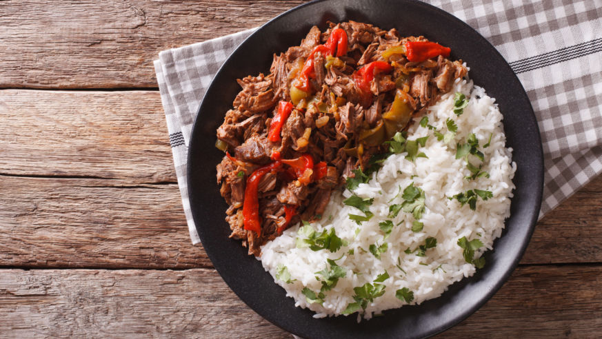 An overhead view of a plate of the Cuban dish Ropa Vieja