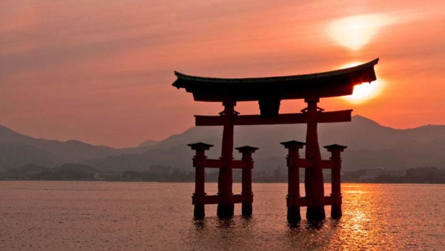 Sunset view of Torii Gate in Miyajima, Japan