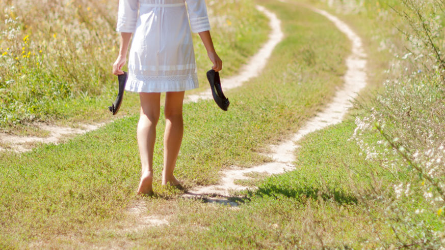 walking down grassy road barefoot