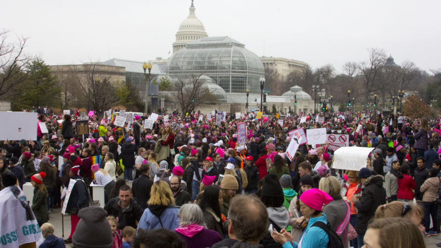 A view from a crowd of marchers at the Women's March in Washington, D.C., with the Capitol building.