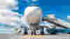 white airplane with boarding ramp