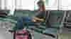 blog_girlusingiphoneatairport_original.jpg