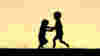 Kids frolicking at sunset