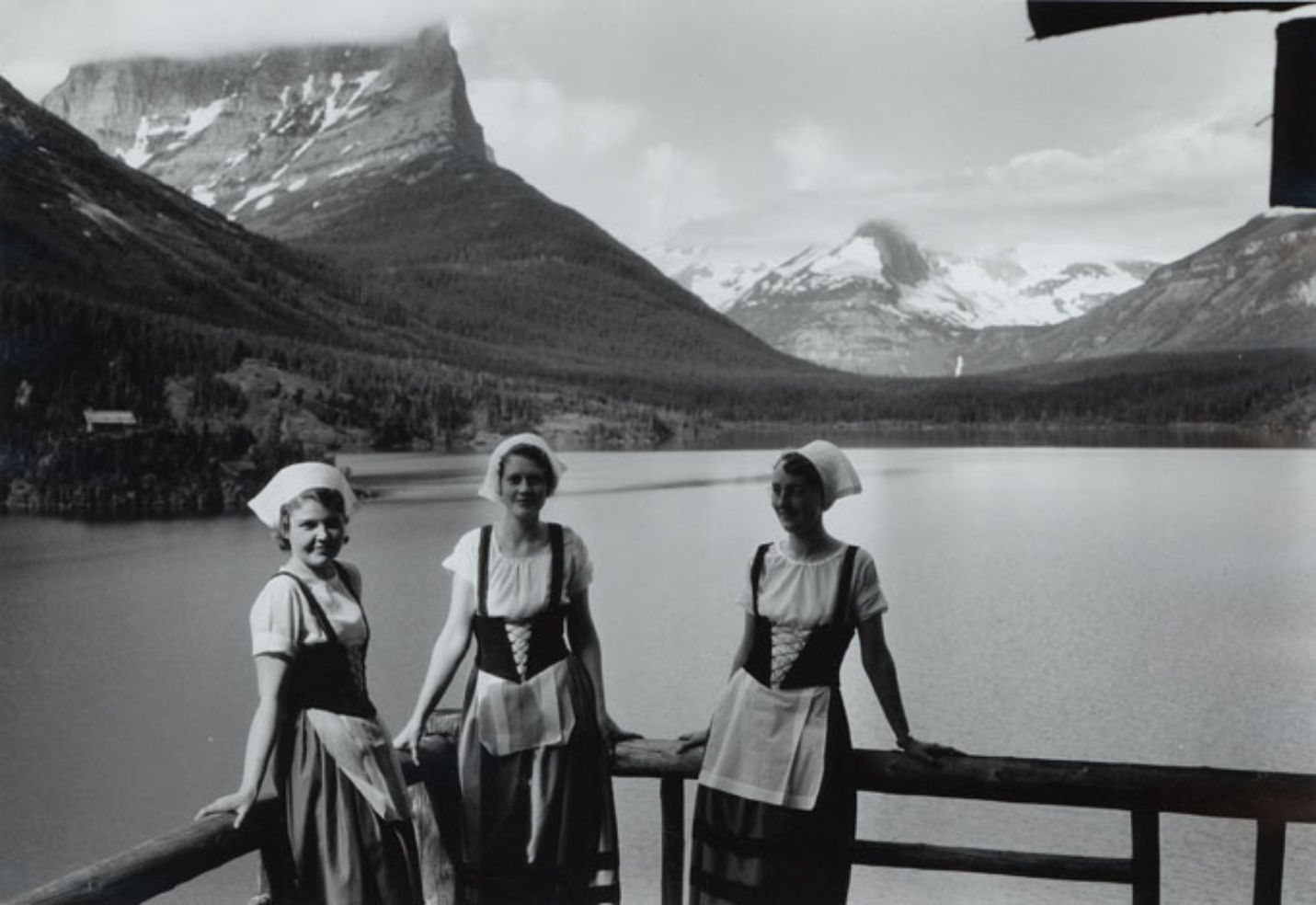 Waitresses, Swiss costume, veranda, Going-to-the-Sun Chalets, Upper St. Mary's Lake, Glacier National Park, Montana