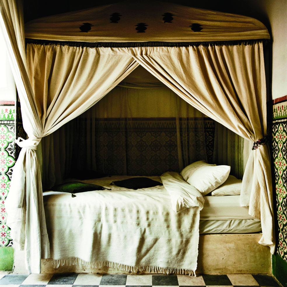 The canopy bed in Room 5 at Riad Tizwa.