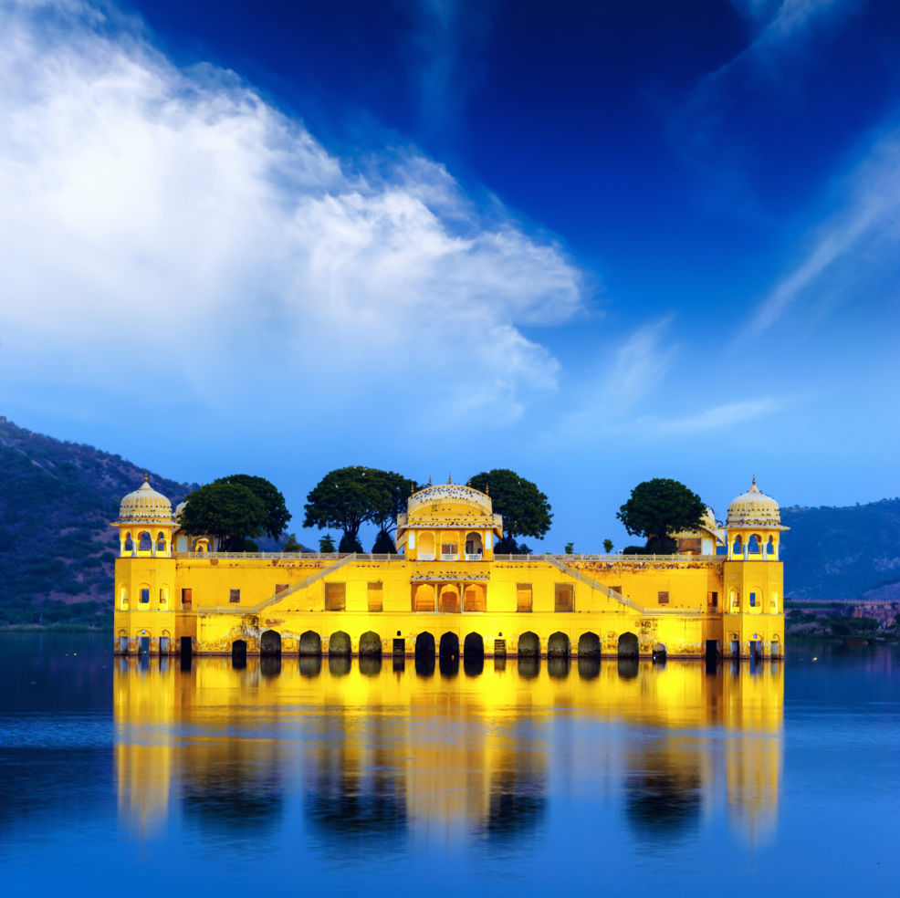 Indian water palace on Jal Mahal lake at night time in Jaipur, India