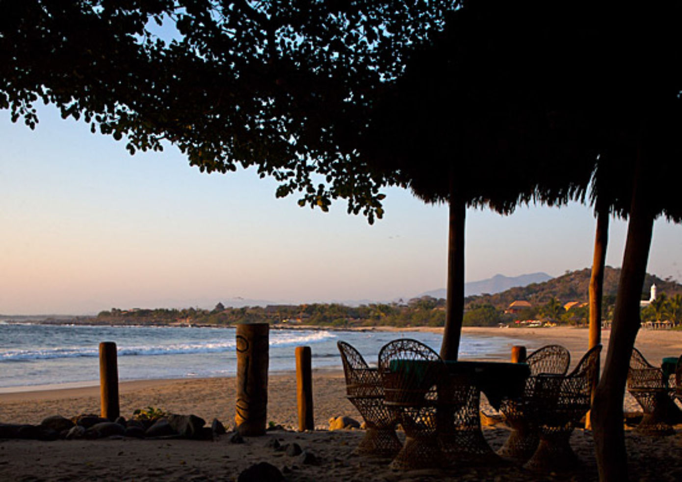 Choose to dine al fresco by the beach at the Inn at Manzanillo Bay's casual restaurant.