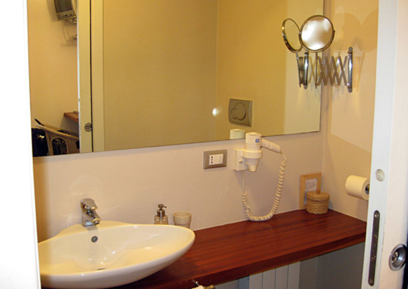 Bathrooms at Arco del Lauro are outfitted with stylish vessel sinks.