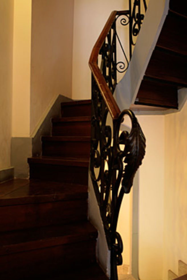 The narrow staircase at Okapi Rooms.