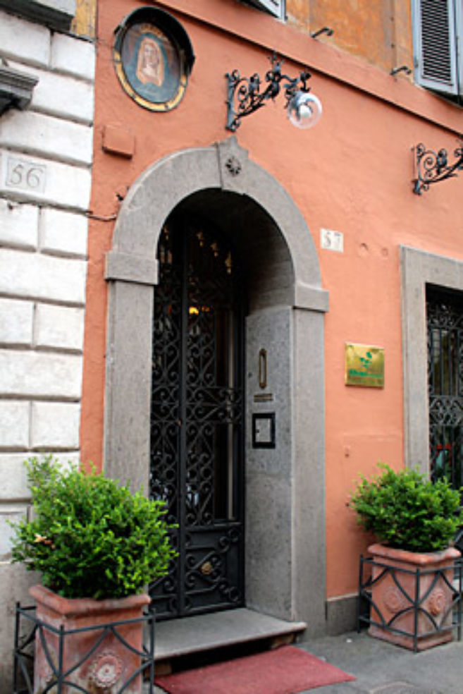 The façade of Okapi Rooms, on a quiet street off Piazza del Popolo.