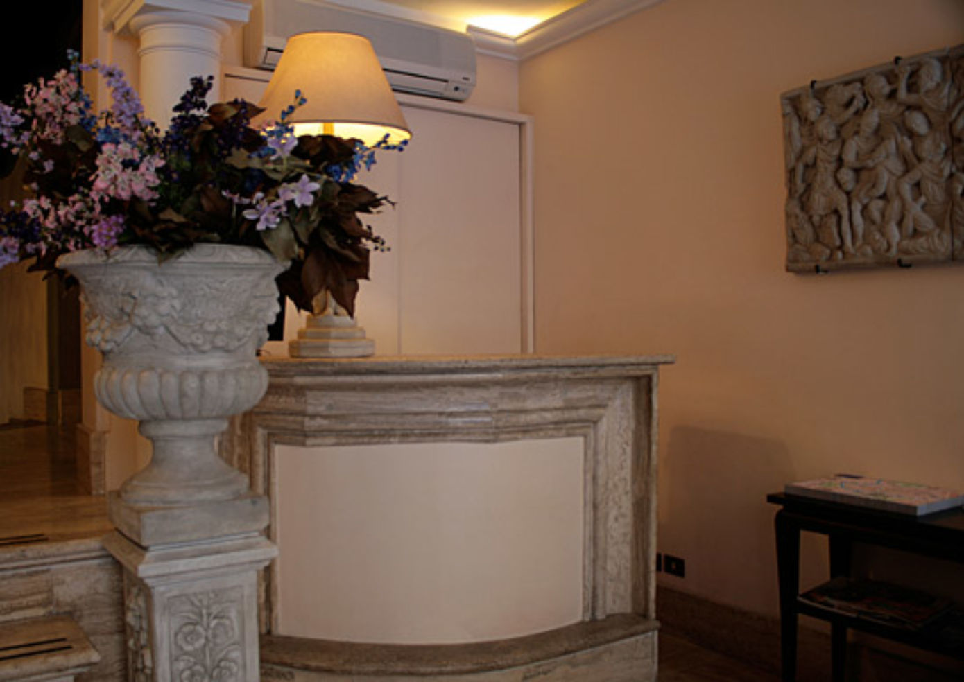 There are no public spaces at Okapi Rooms—the entry barely fits a check-in counter and a loveseat.