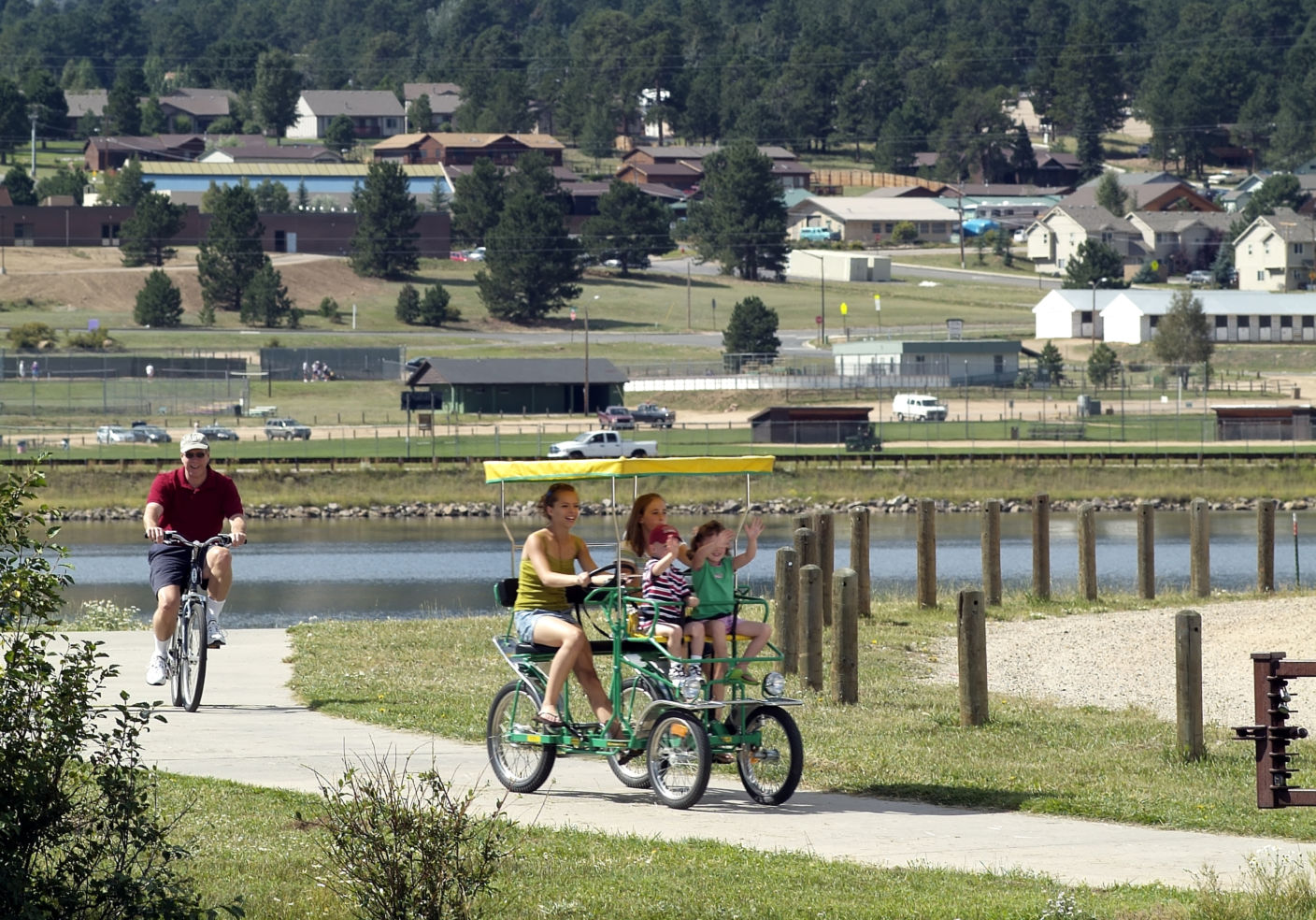 Guests riding the path along Lake Estes