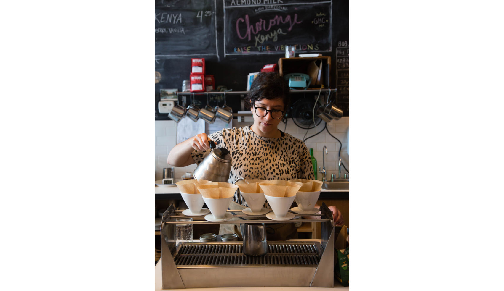 A barista demonstrates the fine art of pourover coffee.