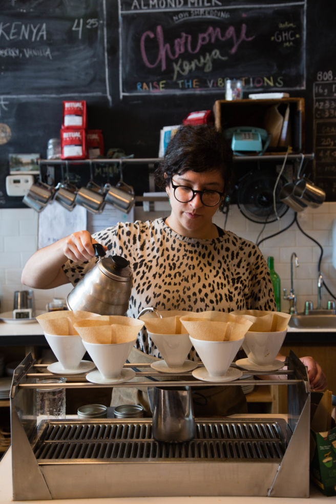 A barista demonstrates the fine art of pourover coffee.