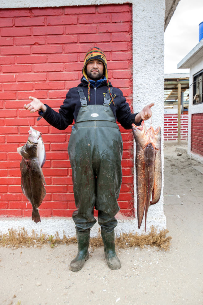 A fisherman displays his fresh catch in Maitencillo