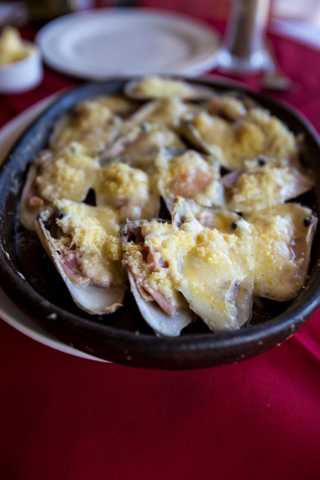 Machas a la Parmesana (pink razor clams with parmesan cheese), a traditional Chilean dish at Restaurant Cesar, Zapallar