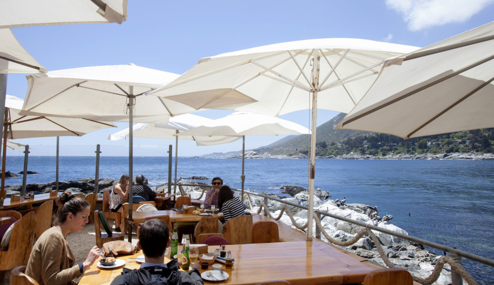 Terrace tables at El Chiringuito, a typical Chilean seafood restaurant in Zapallar