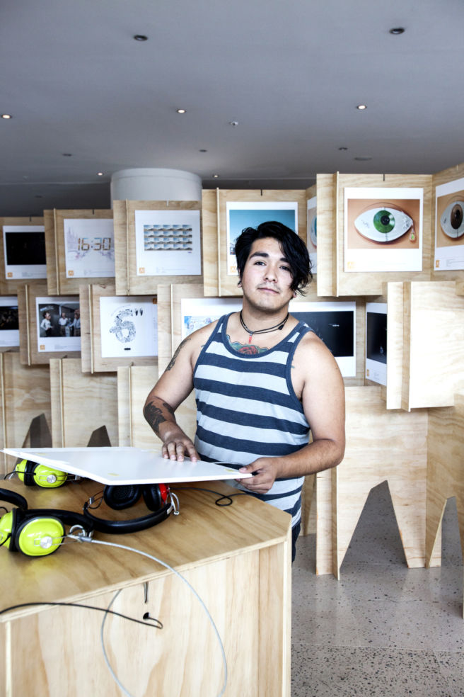 Johnny Acevedo installs a new exhibit at Centro Gabriela Mistral (GAM), an art and cultural center in Barrio Lastarria