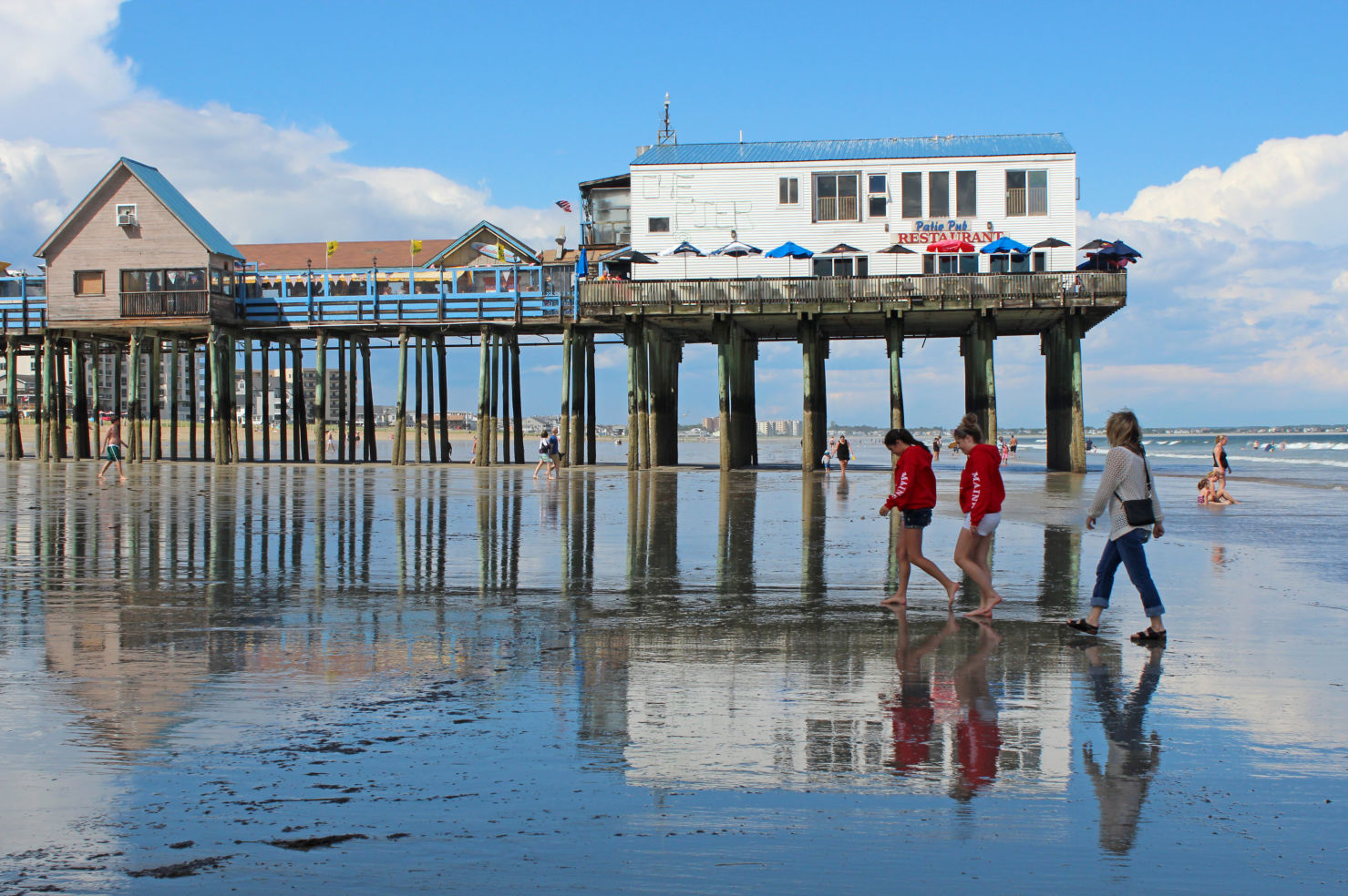 Old Orchard Beach in Maine, USA is a popular summer destination. With its 7 miles of sand, and tourist-oriented businesses, it provides seashore fun.