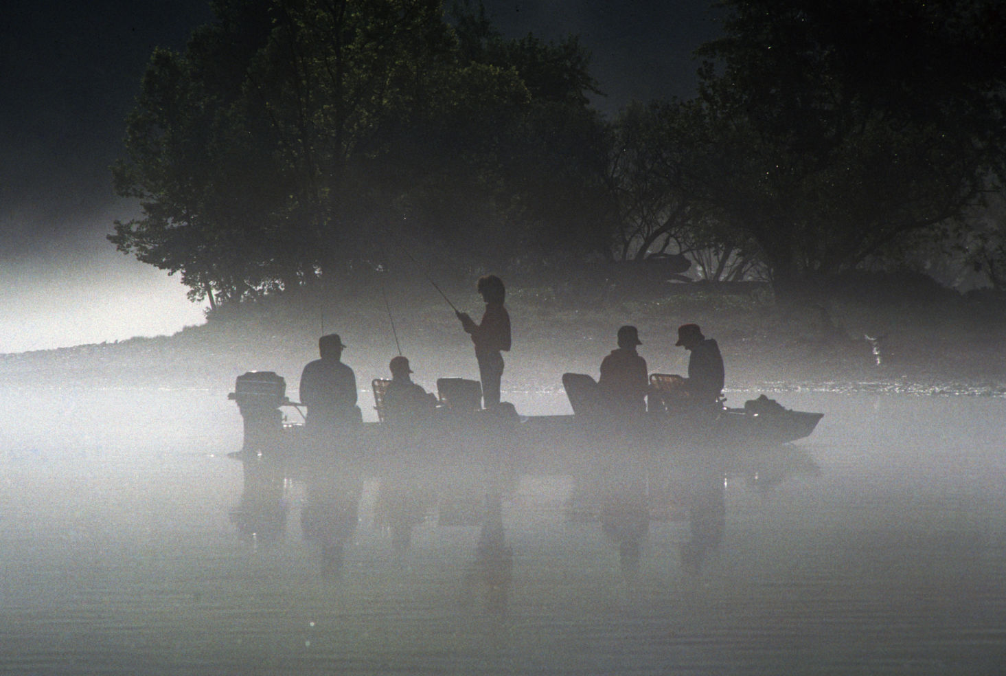 Fishermen, john boat cast, rainbow trout, foggy summer, White River, Ozark Mountains, Arkansas