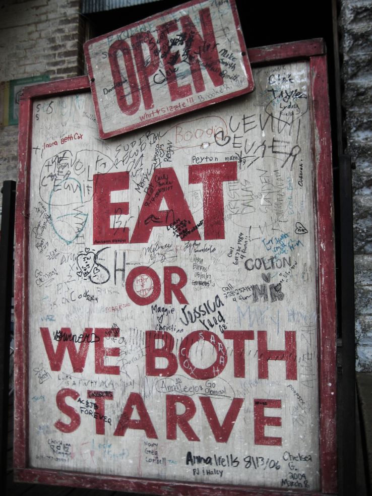 Eat or we both starve sign