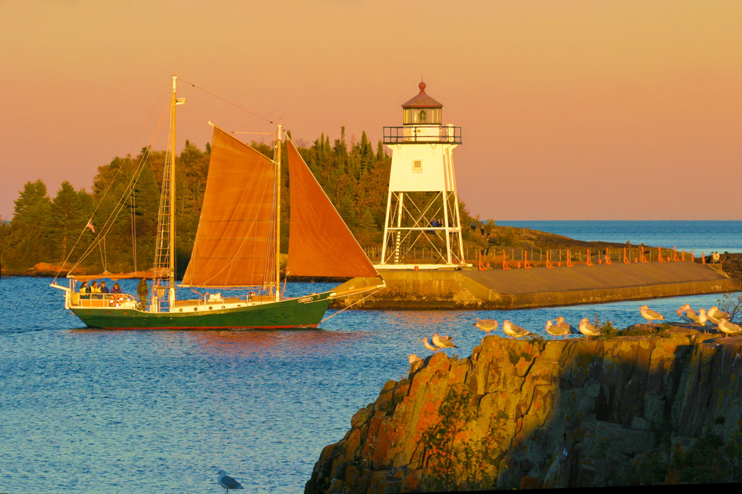 North House Folk Schools sailboat, Hjordis, leaving the harbor in Grand Marais, MN