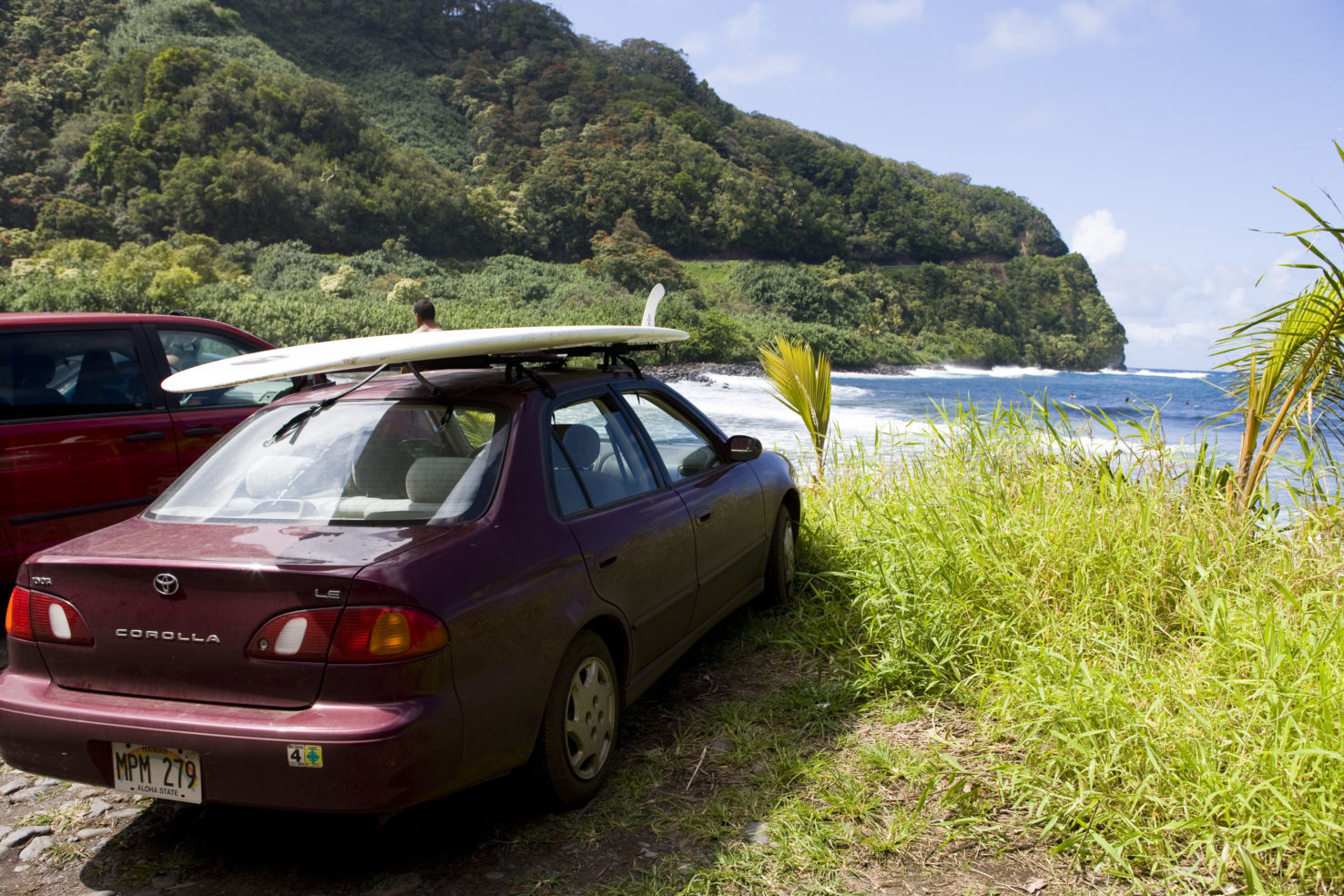 Lonely Planet - United States Car with surf board in Hawaii